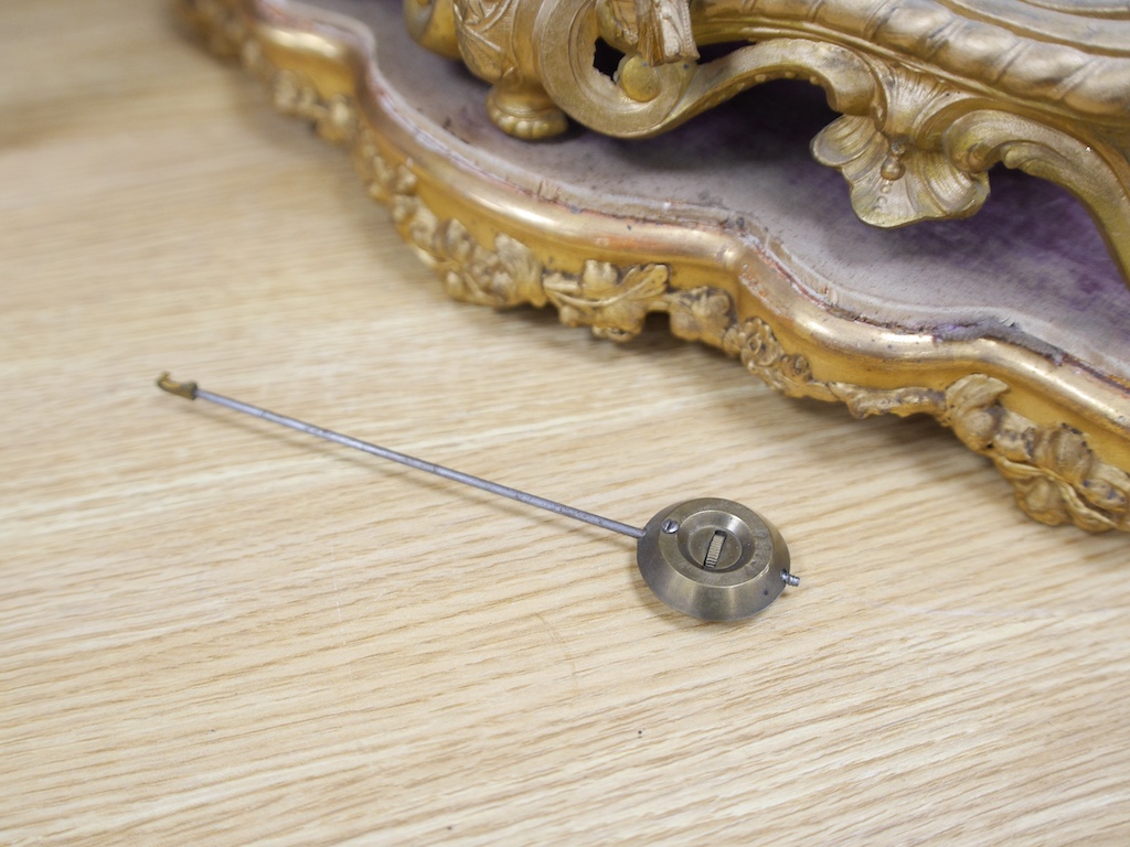 A 19th century French gilt spelter with seated youth mantel clock, with key and pendulum, 43cm. Condition - fair to good, not tested